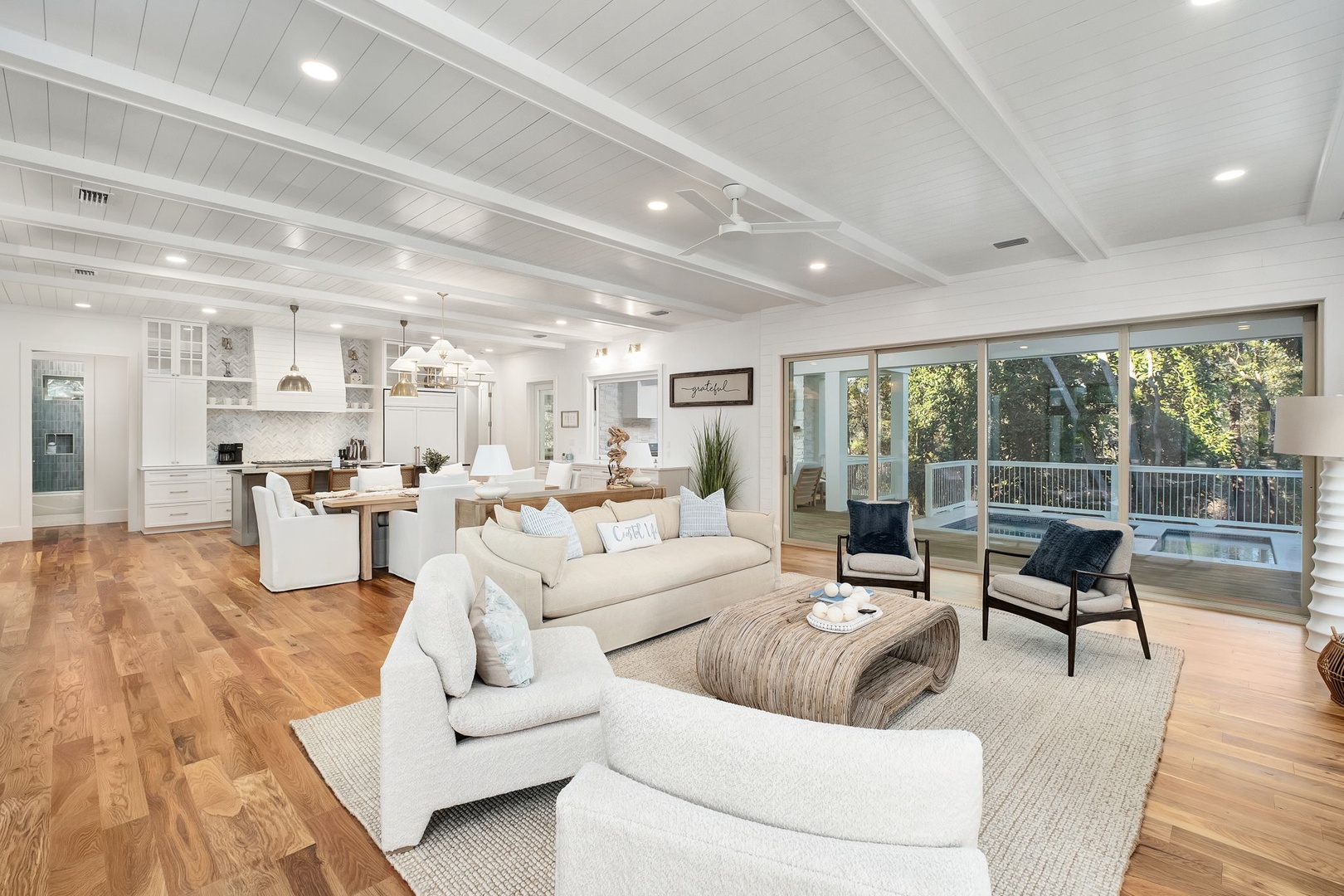 Relax in this stunning open-plan haven where gleaming hardwood floors meet soaring ceilings, while you enjoy seamless flow from kitchen to living space.