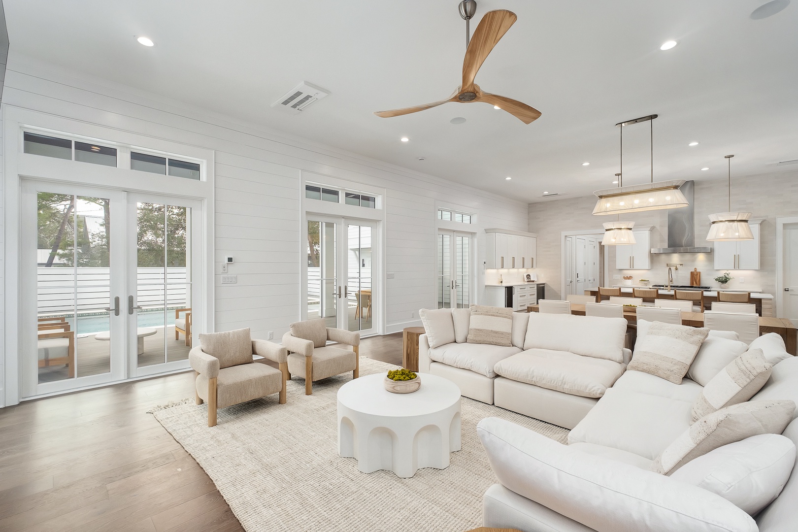 Relax in this stunning open-concept living space where plush seating and modern design create your perfect retreat sanctuary.