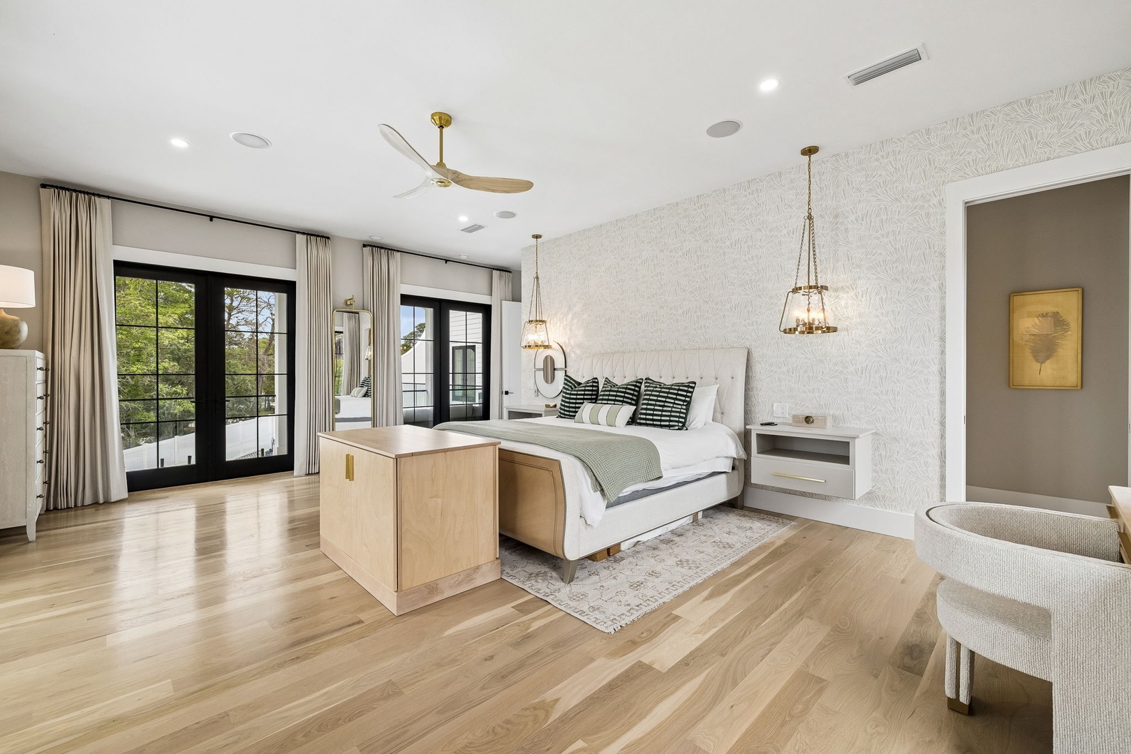 Relax in your spacious retreat with elegant finishes, soft lighting, and doors that open to your private outdoor space—your peaceful sanctuary awaits.