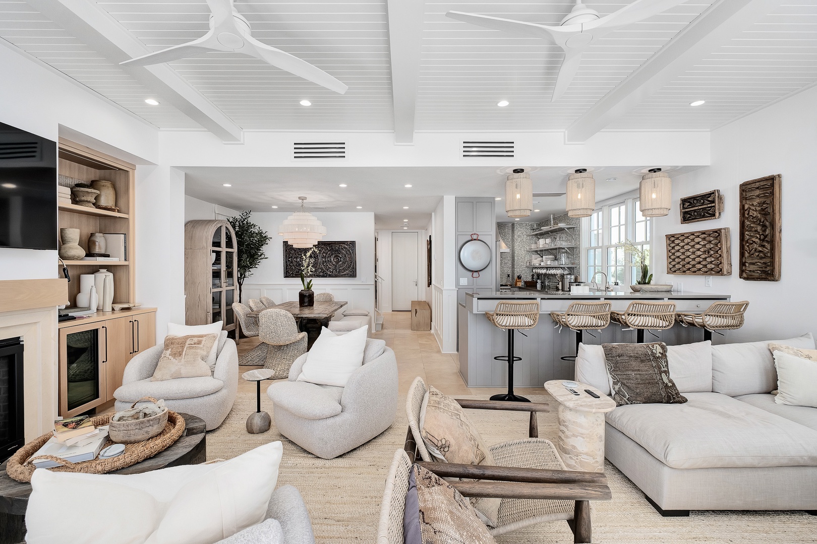 Sink into plush seating in your open-concept haven, where coastal elegance meets modern comfort in this stunning living space.