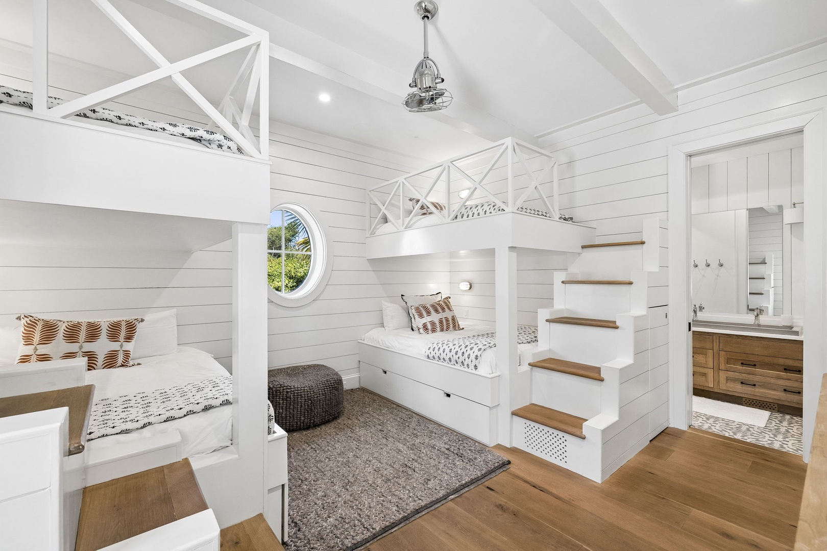Charming bunk room with custom-built beds and warm wood accents, perfect for creating lasting family memories together.