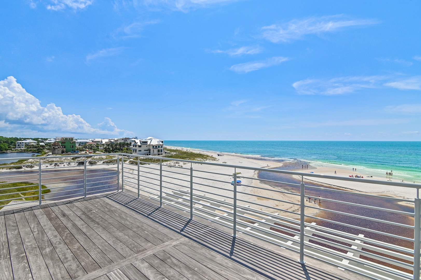 This spacious rooftop terrace offers stunning views of pristine white sand and turquoise water stretching to the horizon—perfect for your morning coffee or evening sunset.