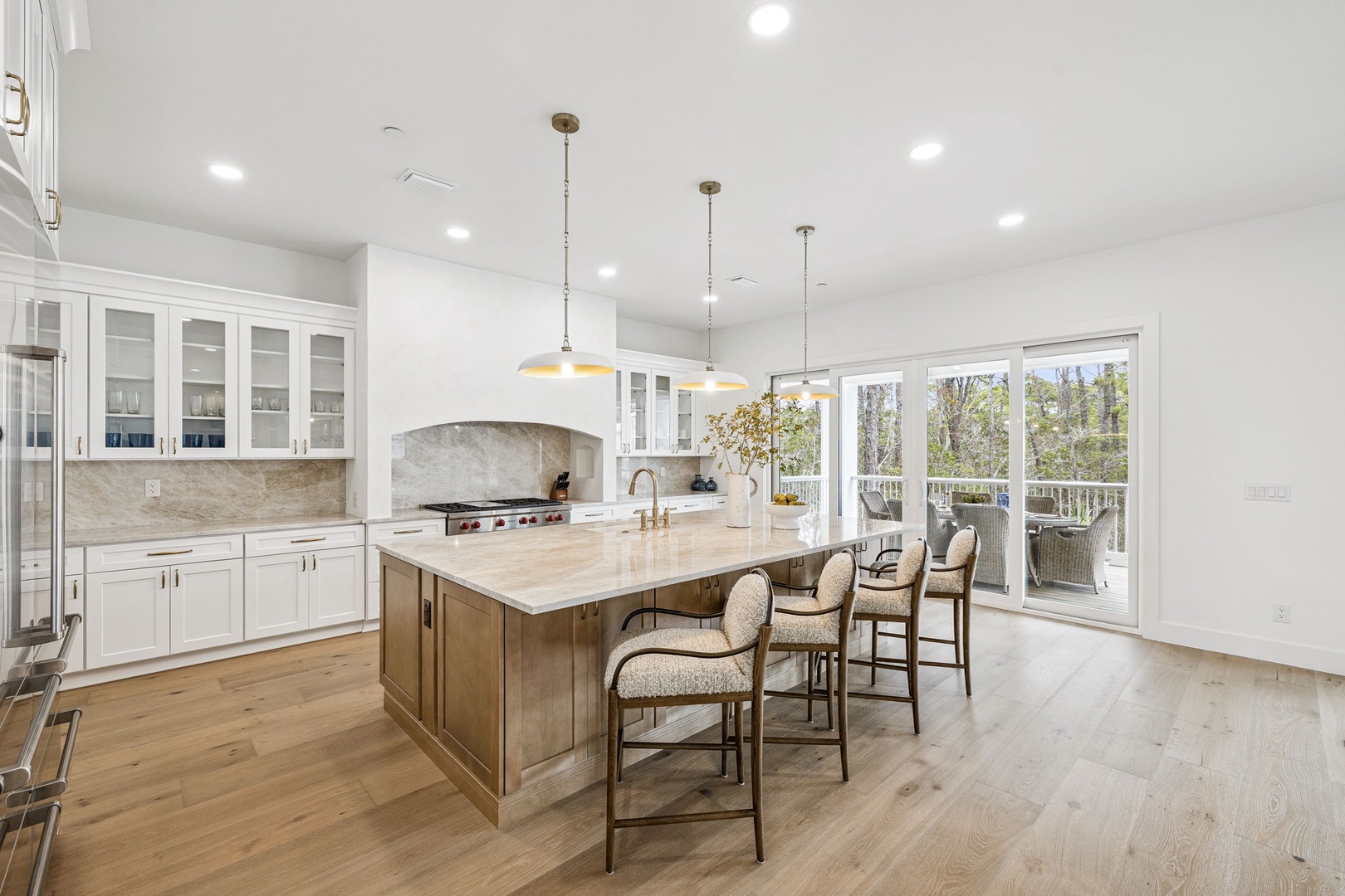 Your spacious kitchen invites culinary adventures with marble countertops, premium appliances, and an island perfect for morning coffee or evening gatherings.