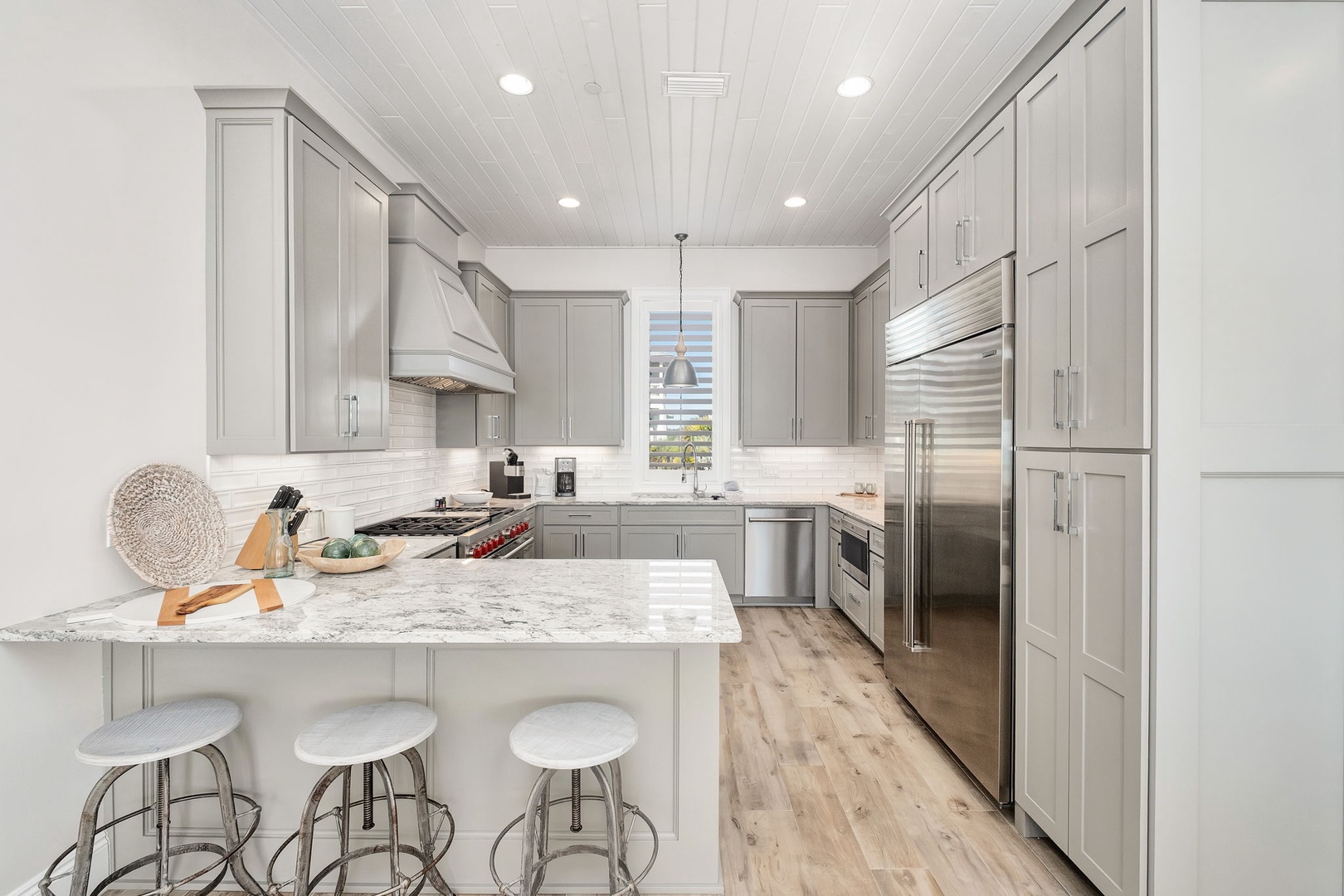Your gourmet kitchen awaits with marble countertops, premium appliances, and a spacious island perfect for cooking memorable meals during your stay.
