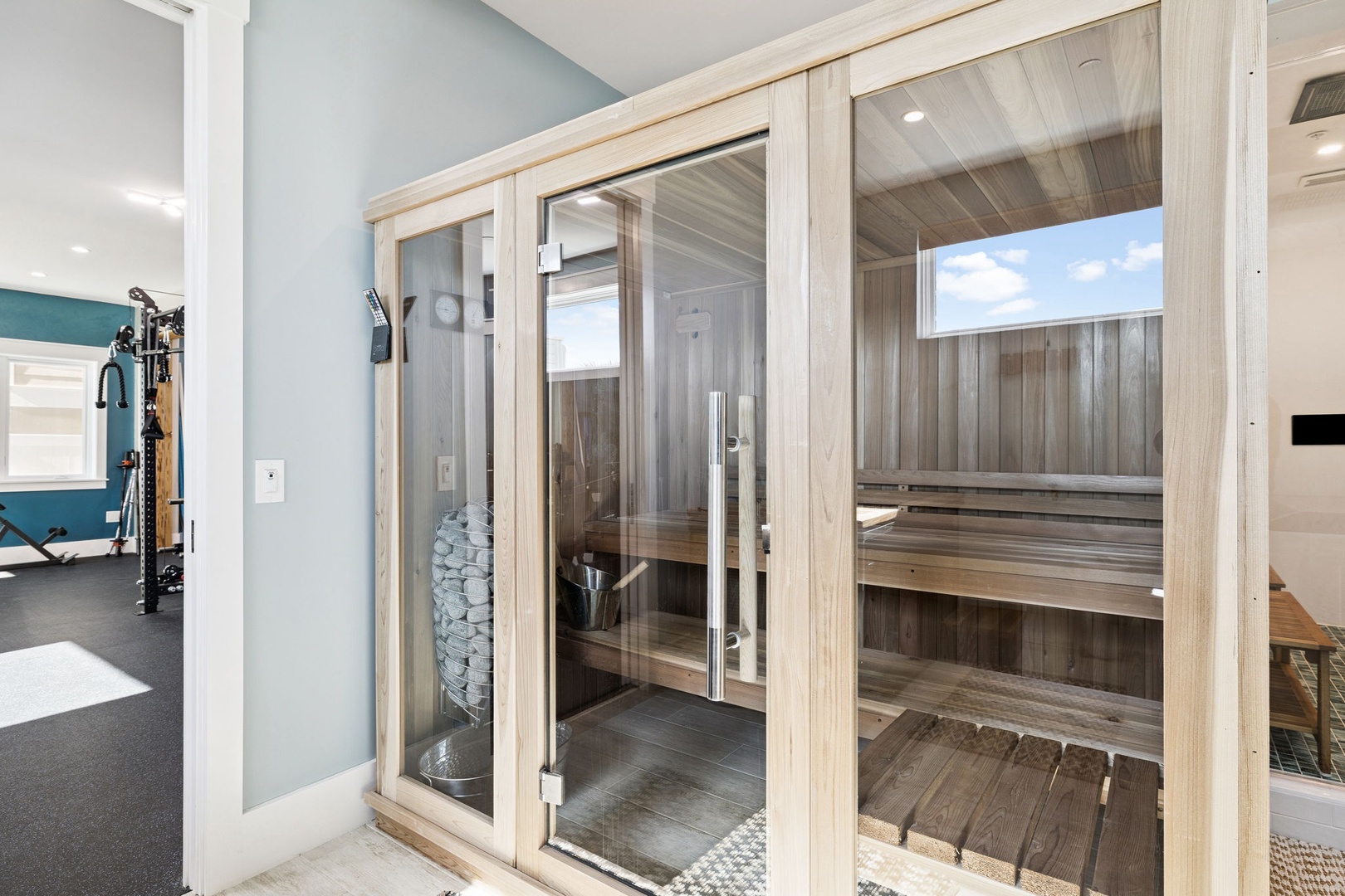 Step into your private sauna sanctuary with natural wood benches and soothing stones, perfect for unwinding after your adventures.