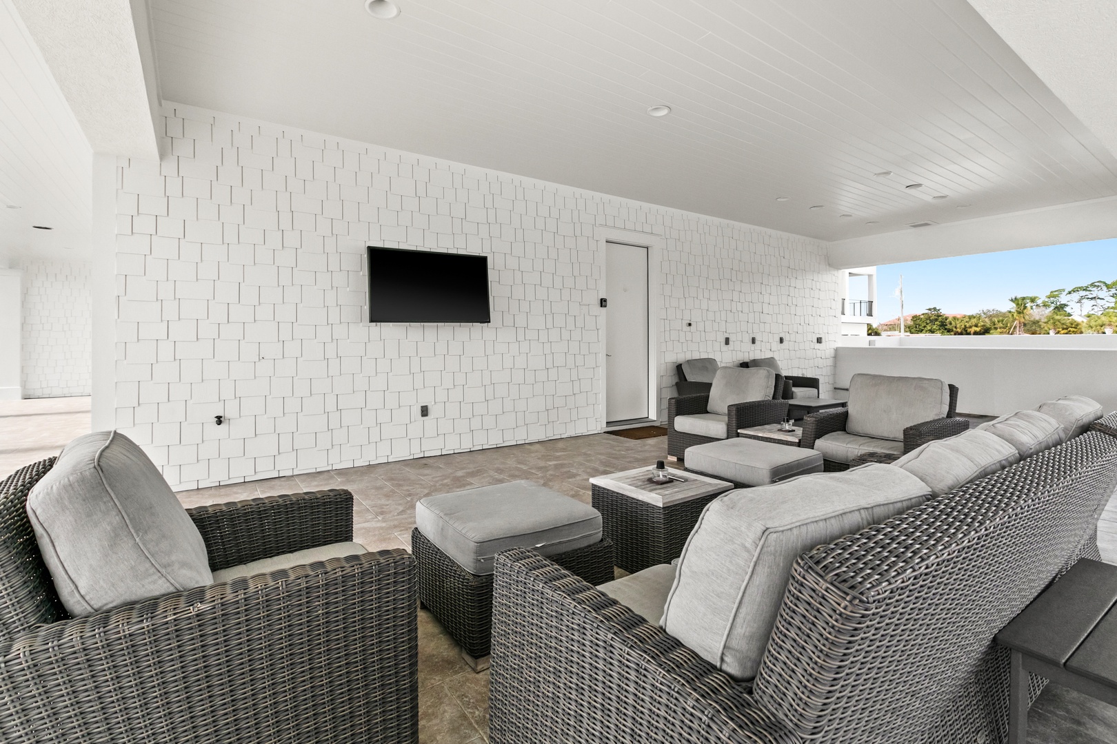 Unwind in your private rooftop lounge, where plush wicker seating and open-air comfort create the perfect setting for evening conversations under the sky.