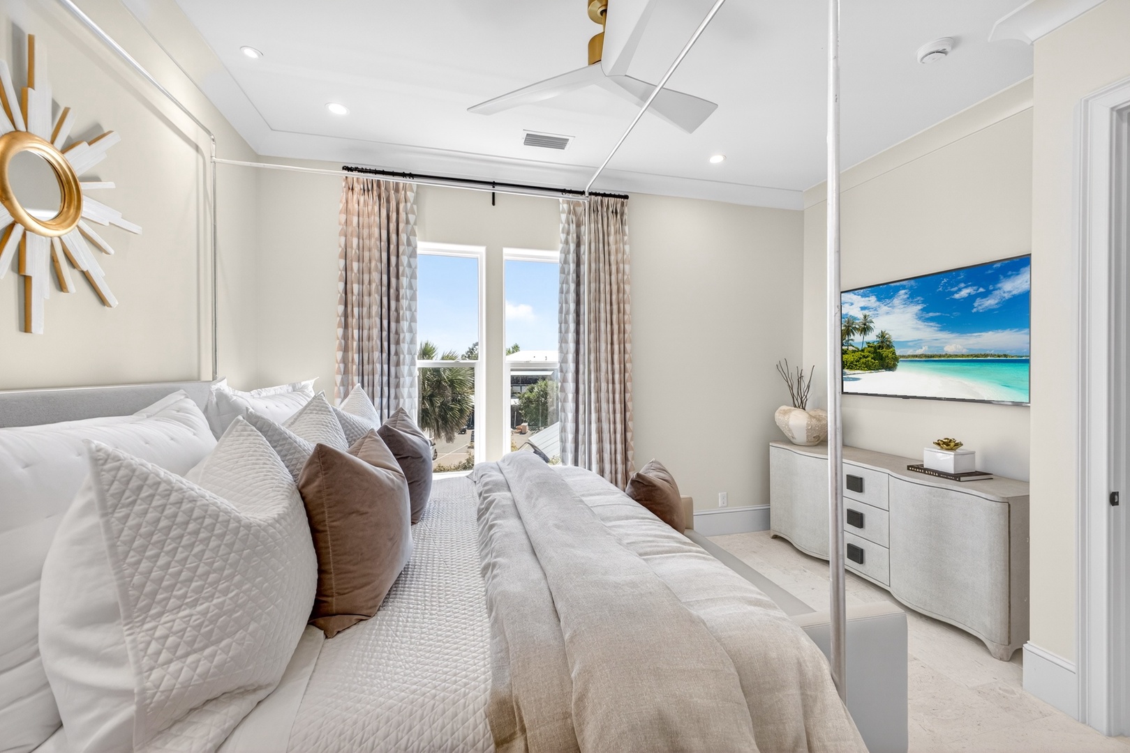 Slip into your serene bedroom sanctuary, where plush bedding invites restful sleep and ocean views on the screen set a tranquil mood before you step out to your private balcony.