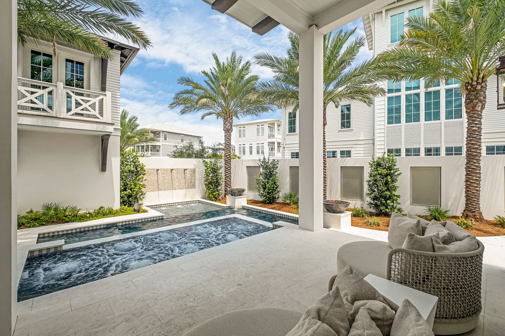 Your private oasis awaits—unwind by the sparkling pool, lounge beneath swaying palms, and soak up the sun in your own tropical retreat.