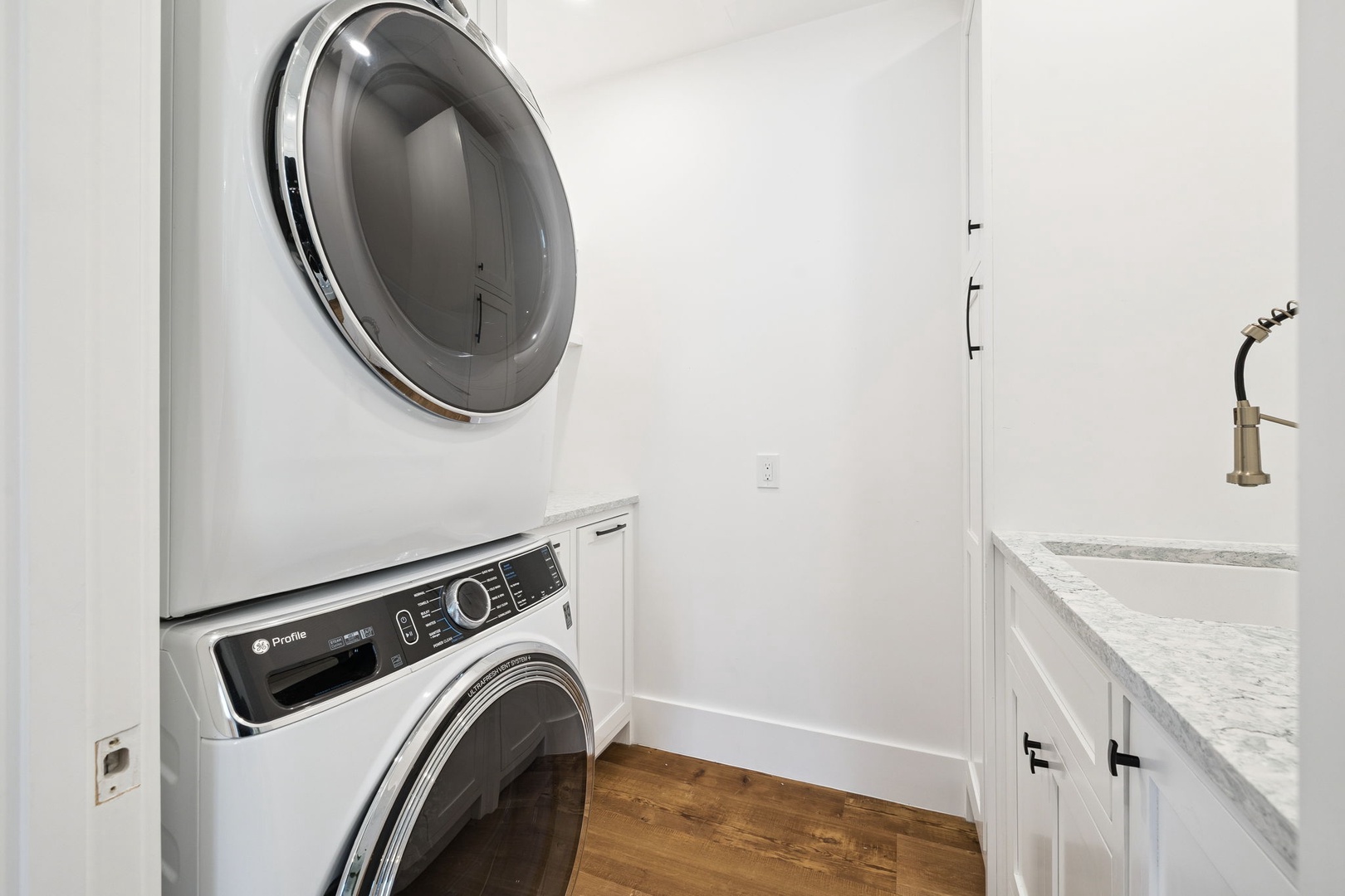 You'll love having a full-size washer and dryer in your private laundry room, complete with a convenient utility sink for all your needs.