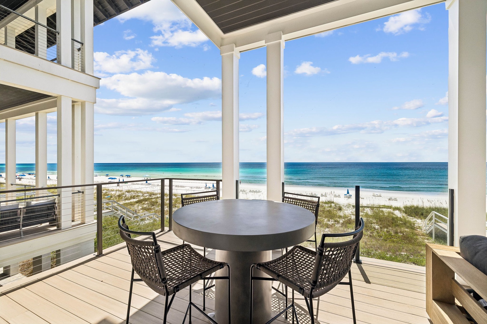 Step onto your private deck and take in the stunning turquoise waters just steps away. Gather around the outdoor table, feel the sea breeze, and let the endless ocean views become your daily backdrop.