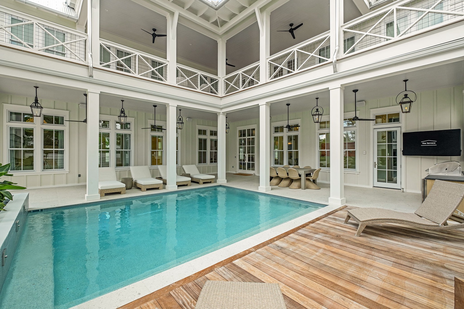 Dive into your own private paradise with this stunning indoor pool surrounded by elegant columns, wraparound loungers, and a light-filled courtyard above, offering your ultimate retreat any time of day.