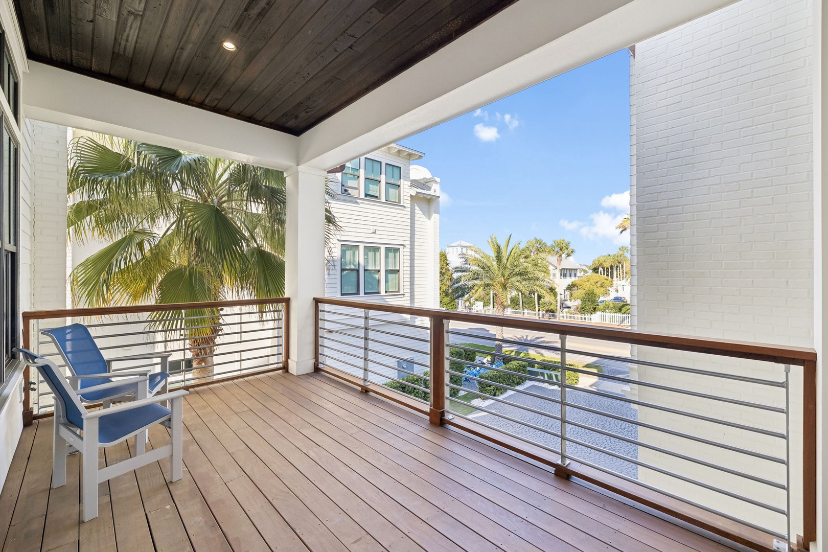 Unwind on your private balcony with tropical views and comfortable seating—your perfect spot for morning coffee or evening relaxation.