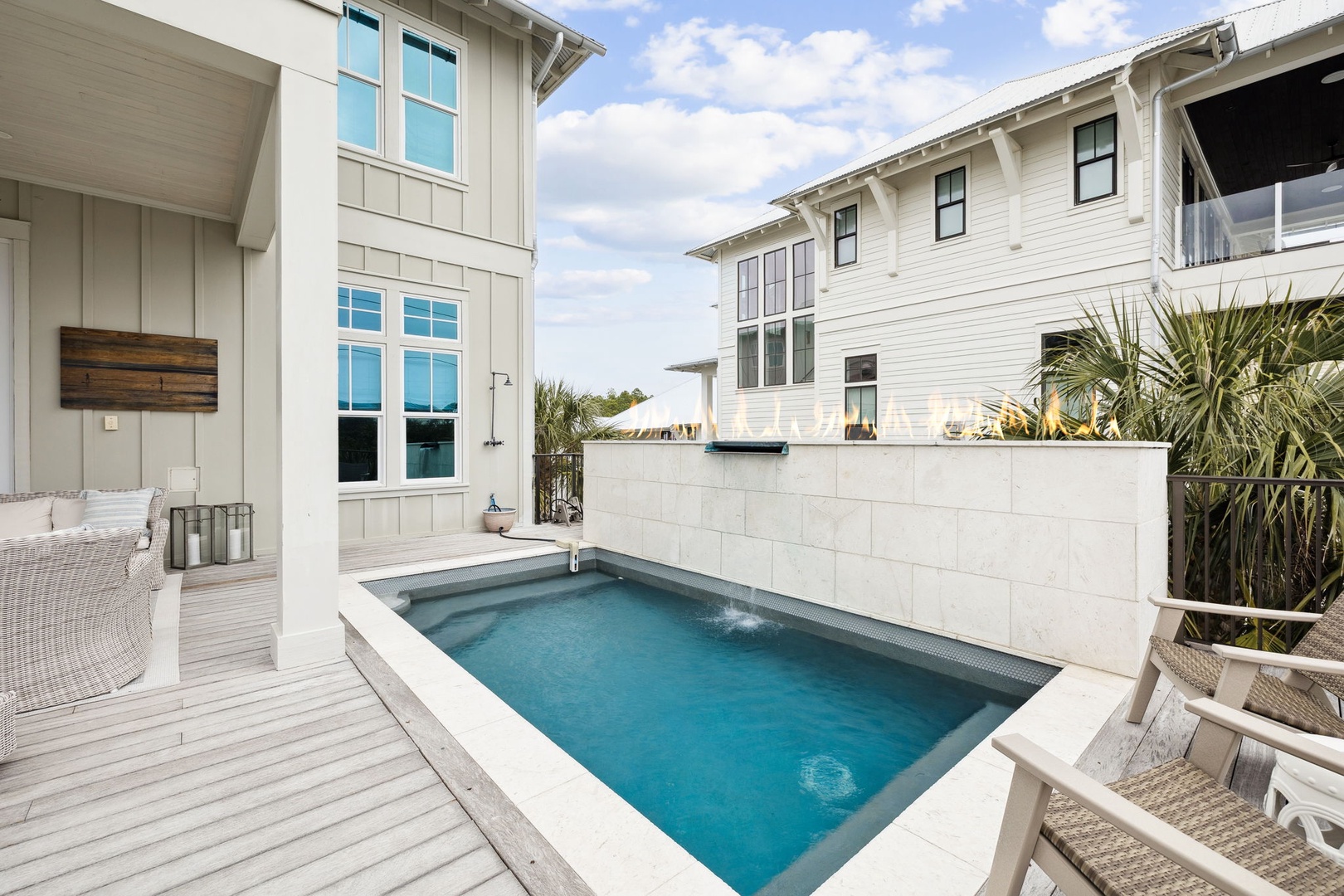 Dive into your private pool sanctuary surrounded by coastal architecture and swaying palms—your perfect escape awaits.