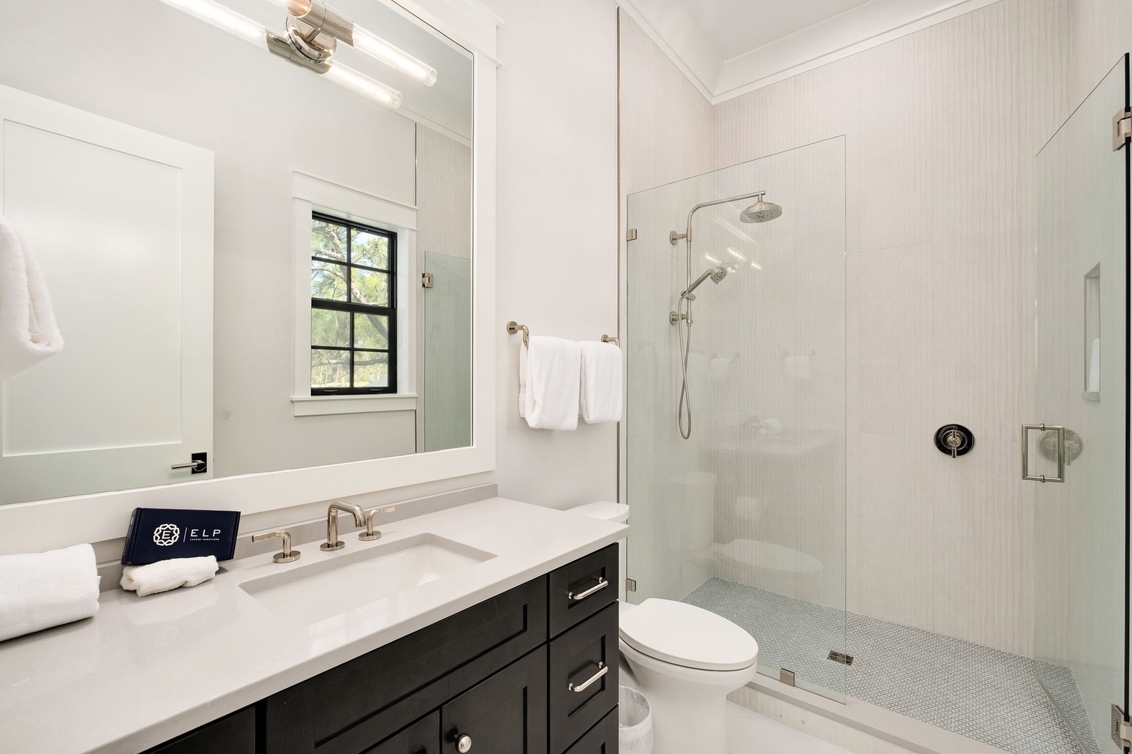 Step into your elegant ensuite sanctuary with a spacious walk-in shower and sophisticated finishes throughout.