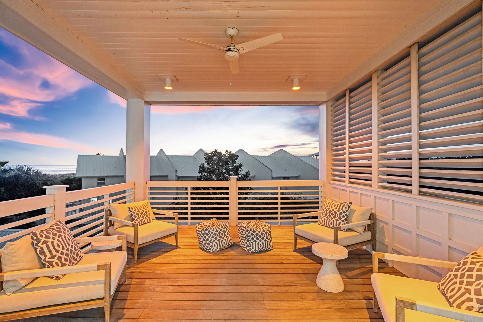 Unwind on your private balcony with plush seating and warm wood accents as twilight paints the sky in stunning pastels.