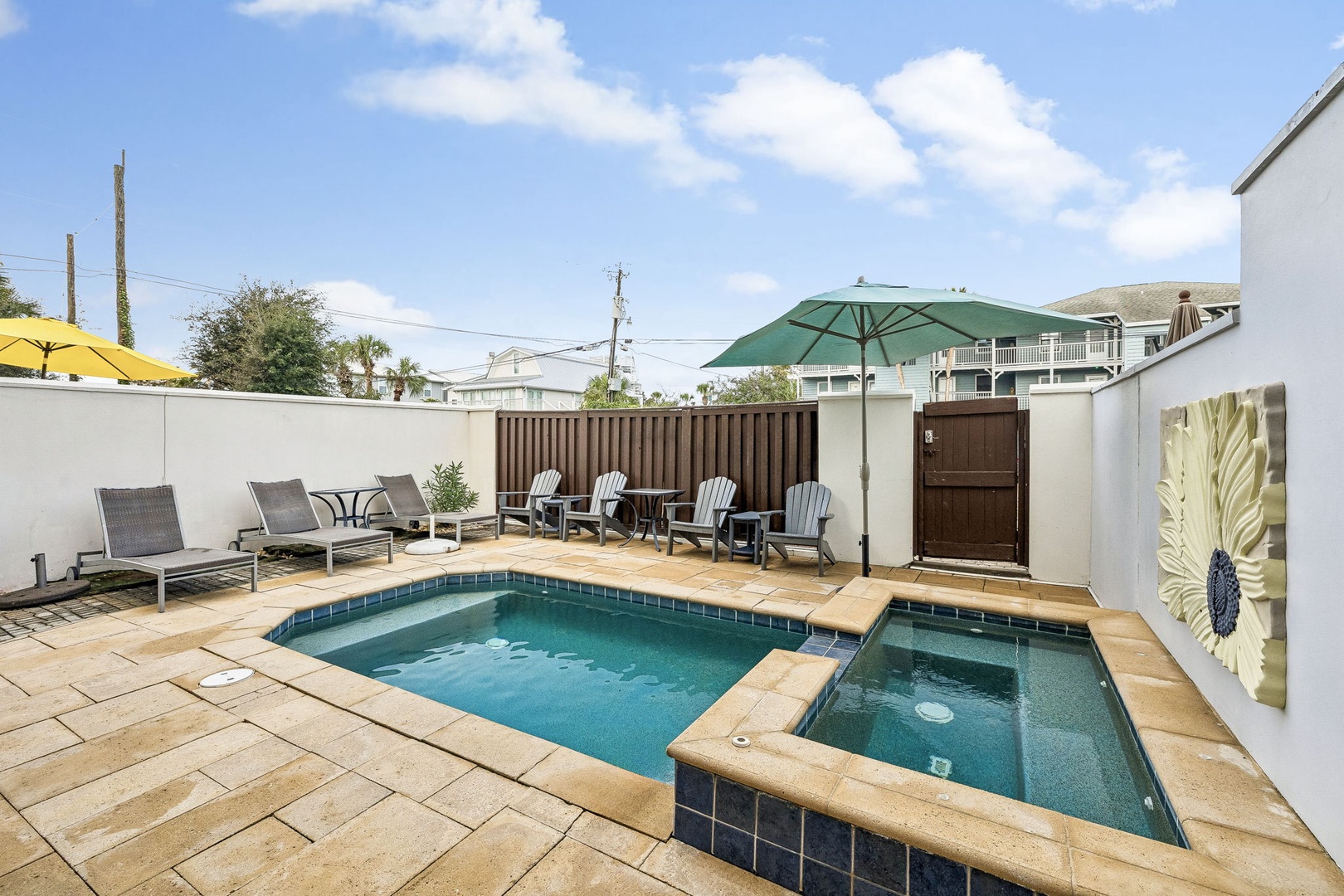 Step into your private outdoor retreat with a sparkling pool and hot tub, surrounded by plenty of sun loungers and shaded seating. Perfect for soaking up the sun or unwinding under the stars.