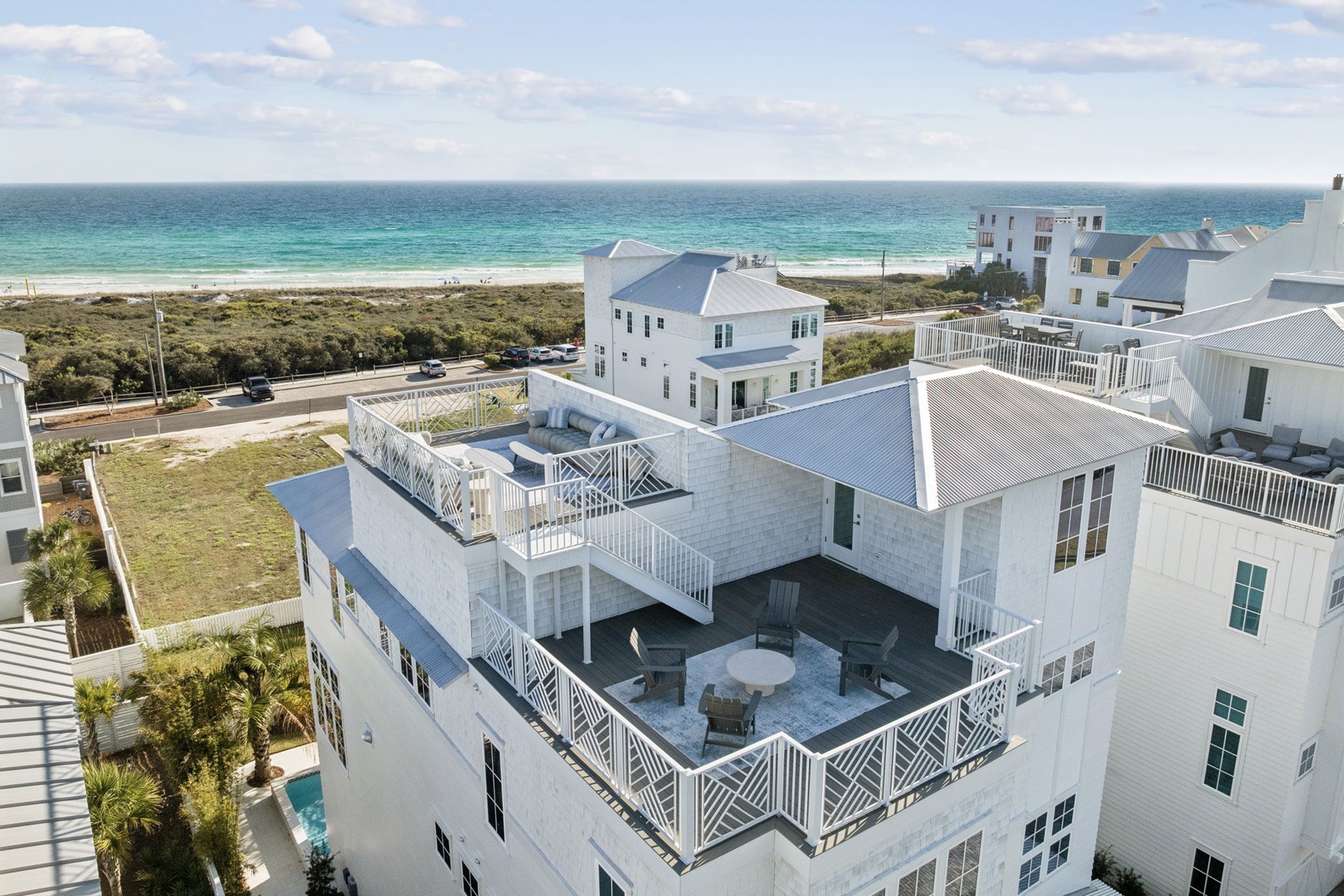 Coastal vacation home with rooftop terrace and direct beach access in beautiful seaside community.