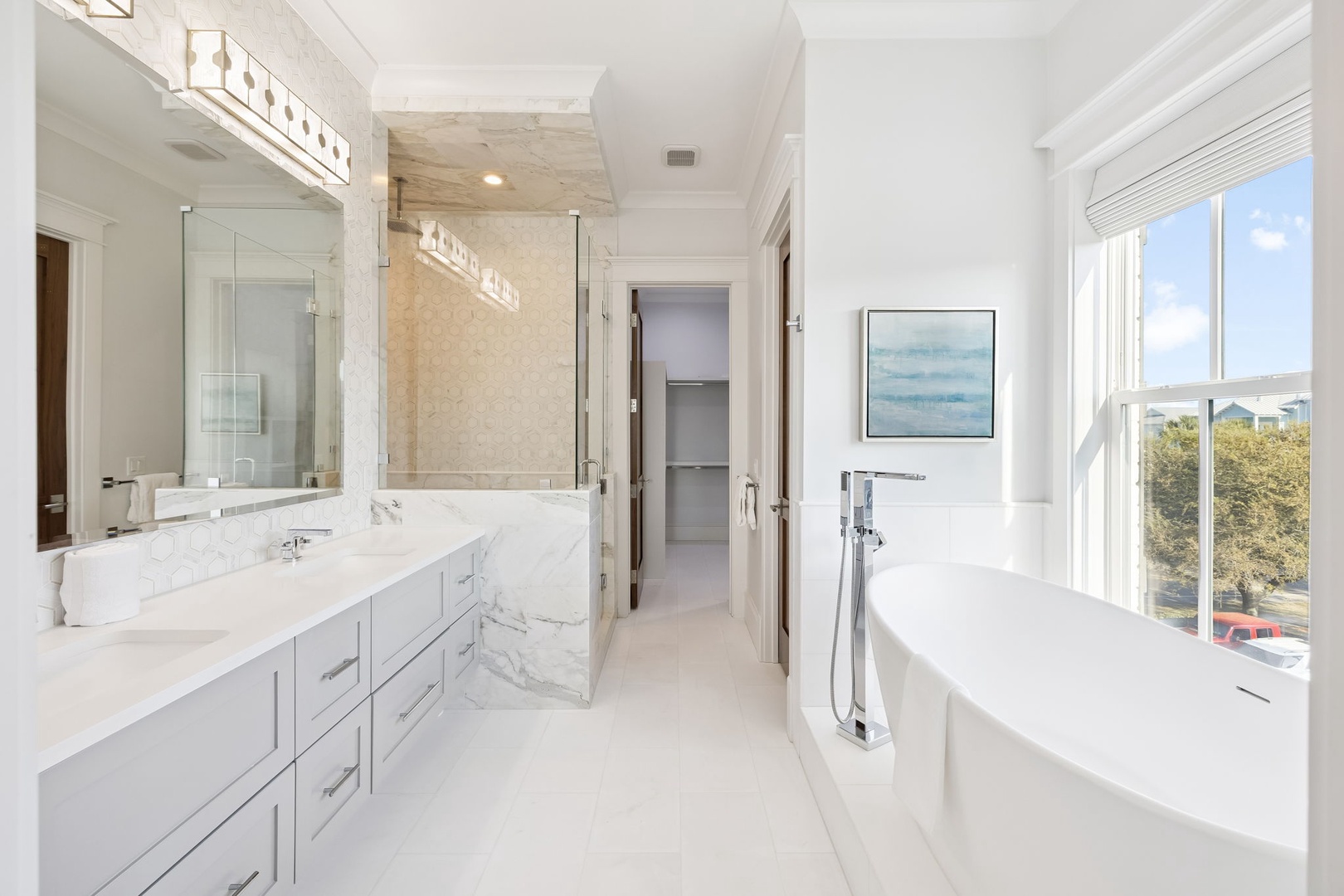 Your luxurious ensuite bathroom features a soaking tub, marble vanity, and glass shower for ultimate relaxation.