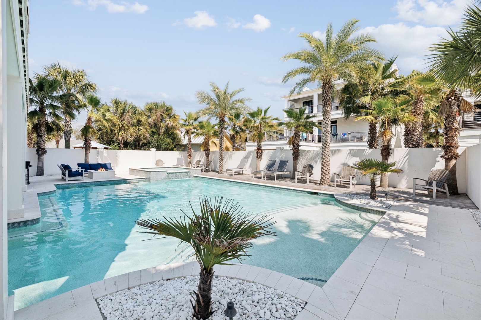 Dive into your private tropical oasis surrounded by swaying palms and modern comfort, where crystalline waters invite endless relaxation.