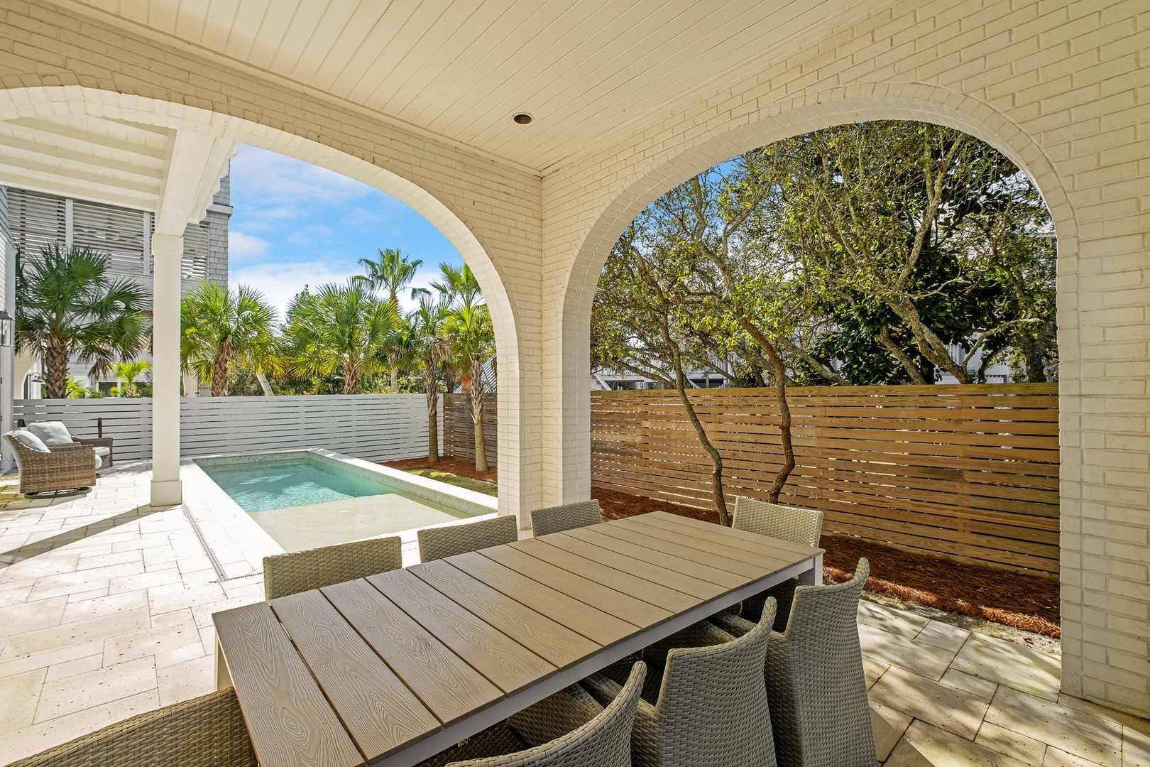 Dine al fresco at your private outdoor table while enjoying views of your sparkling pool and tropical landscaping.
