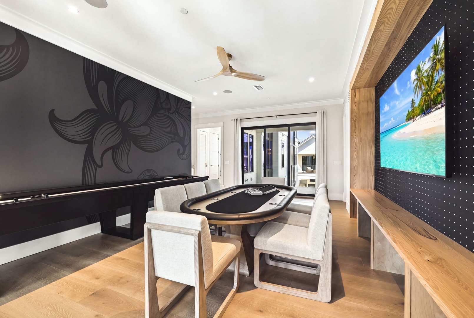 Your private game room blends elegance with entertainment—challenge friends at the poker table, shoot pool, or relax with your favorite shows on the big screen.