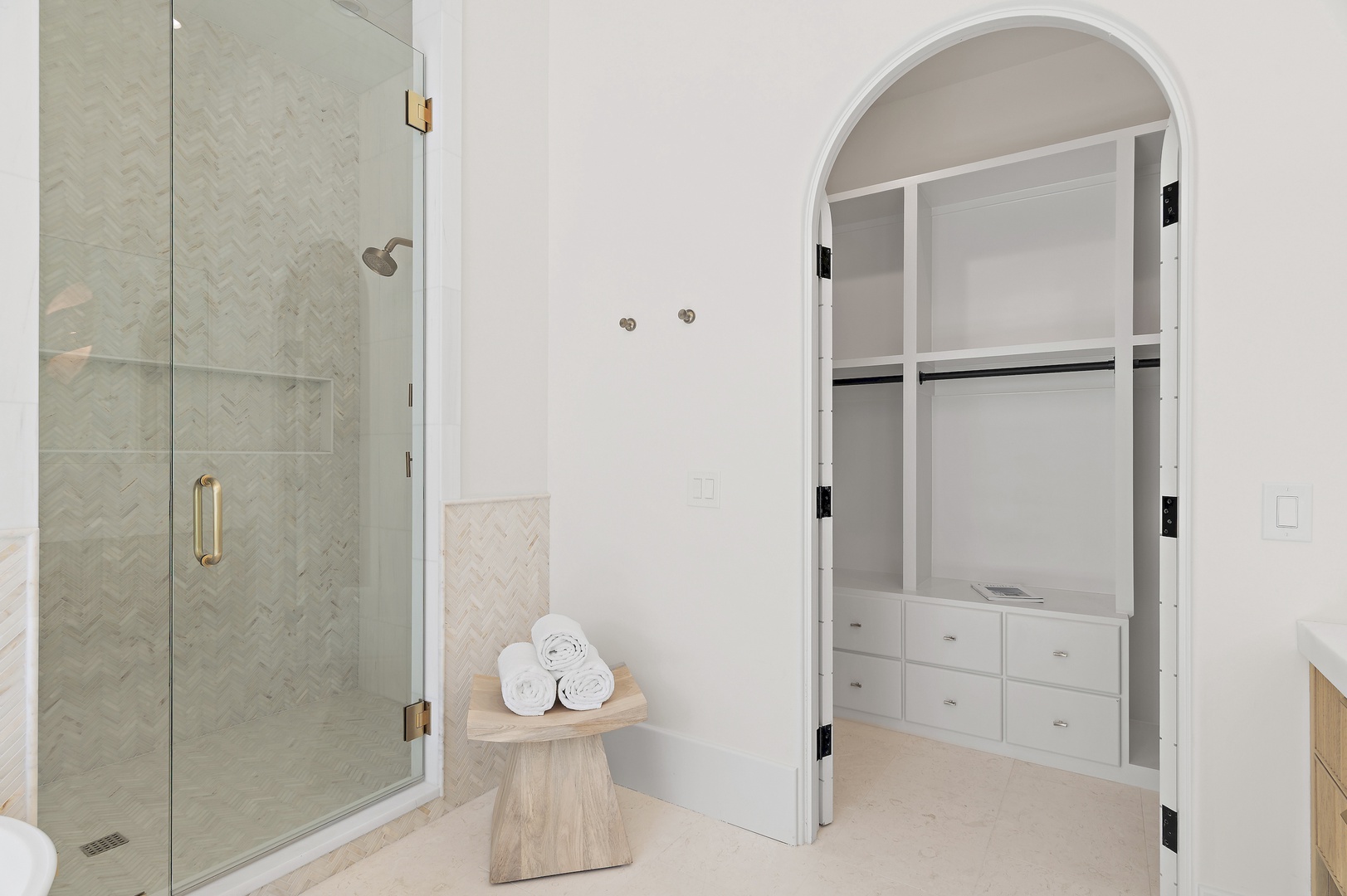 Step into your serene ensuite sanctuary with a spa-like walk-in shower and ample closet space for all your belongings. Fresh towels await, ready to wrap you in comfort after every refreshing rinse.