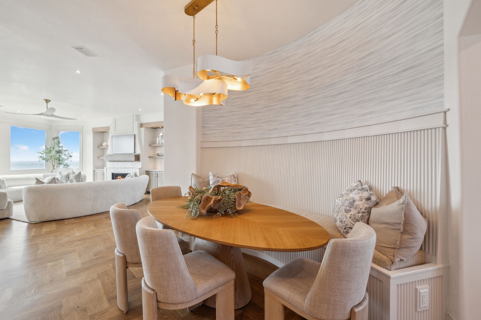 Gather around this elegant oval table and enjoy meals in a bright, open space with stylish coastal-inspired touches and a seamless flow to the living area.