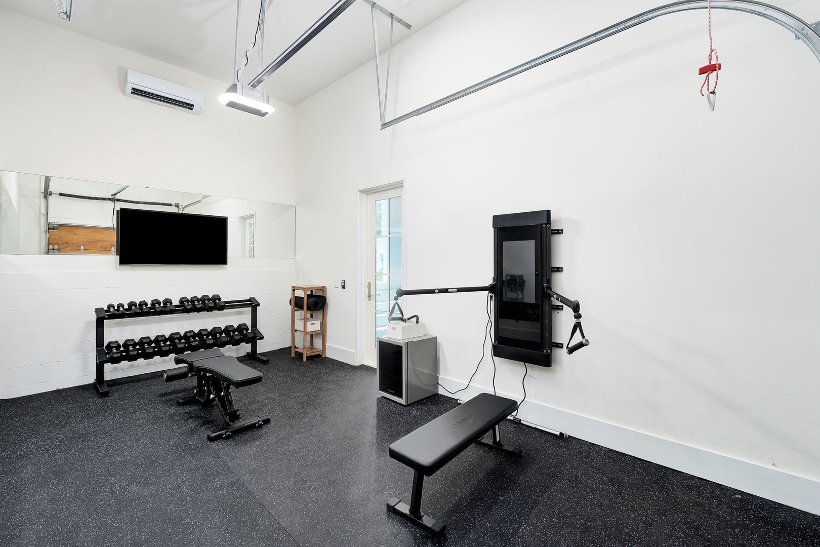 Stay active in your own private fitness space, complete with free weights, workout bench, and cable machine—perfect for maintaining your routine.