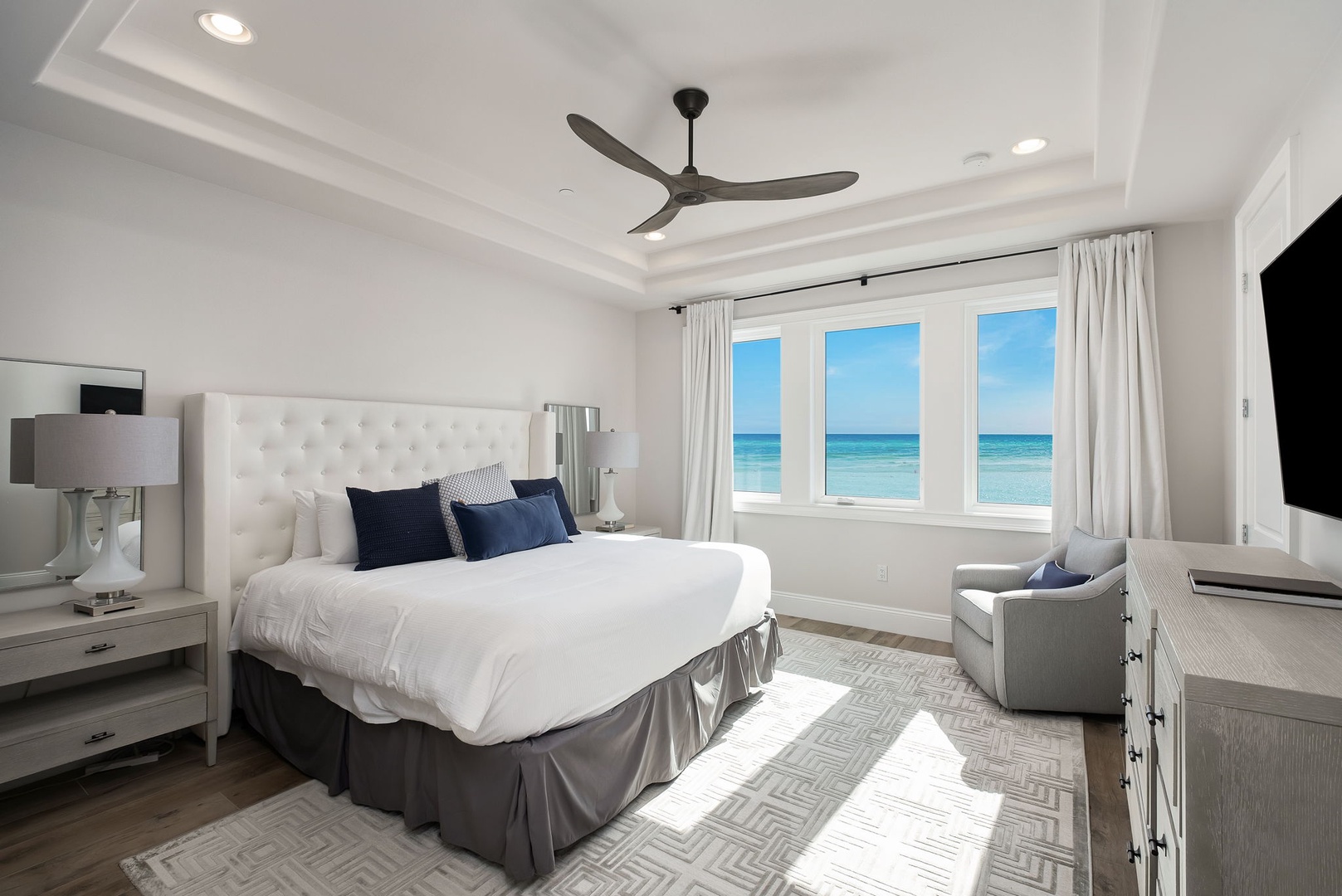 Wake up to stunning ocean views from your luxurious bedroom, where crisp linens and gentle sea breezes create the perfect coastal retreat.