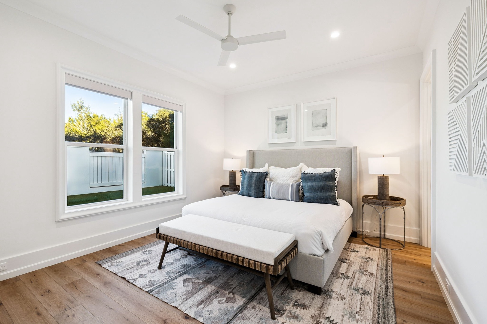 Drift off in this serene bedroom where soft linens meet natural light, creating your perfect peaceful retreat.