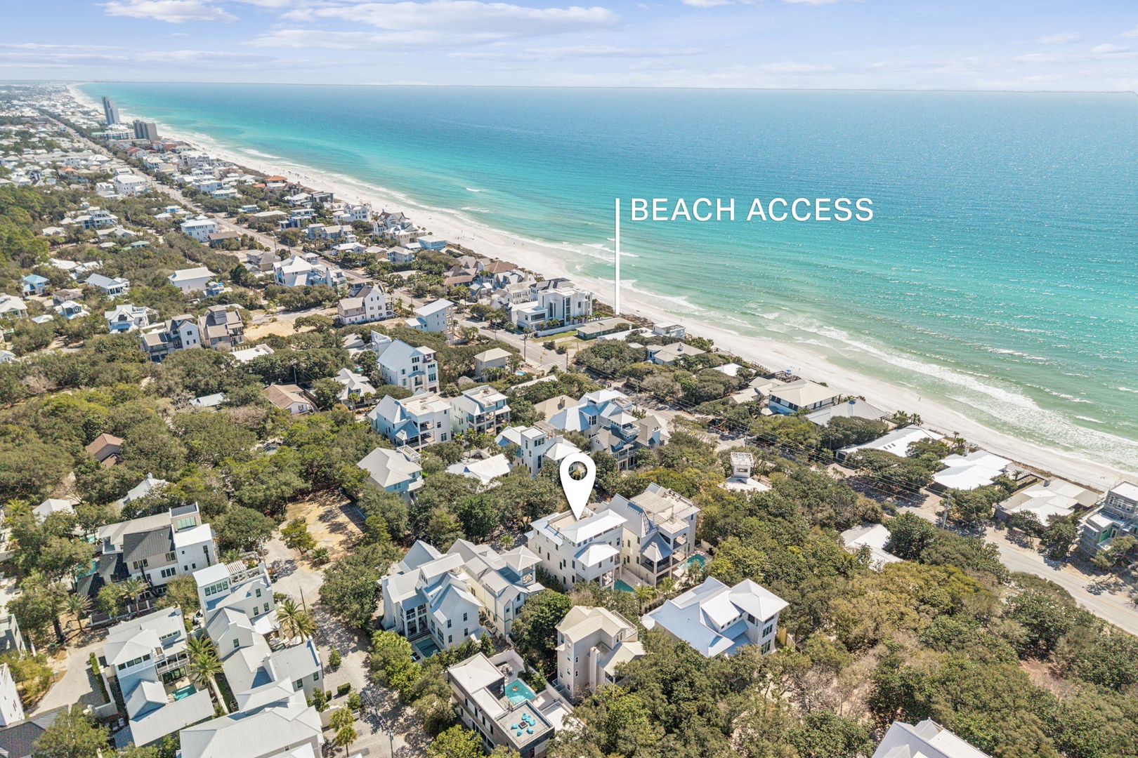 Aerial view of beachside community showing property location with easy beach access via nearby walkway.