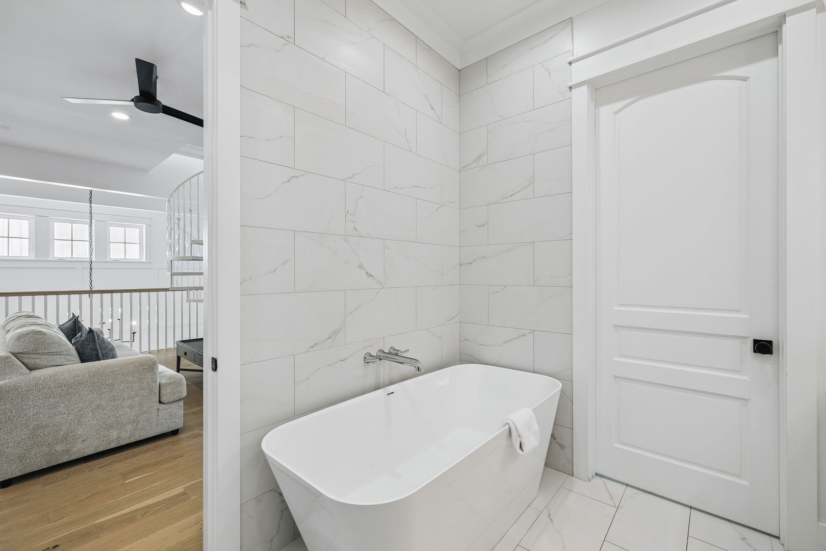 Slip into this luxurious freestanding tub and let the elegant marble-look tiles and tranquil ambiance wash away your worries after a day of adventure.