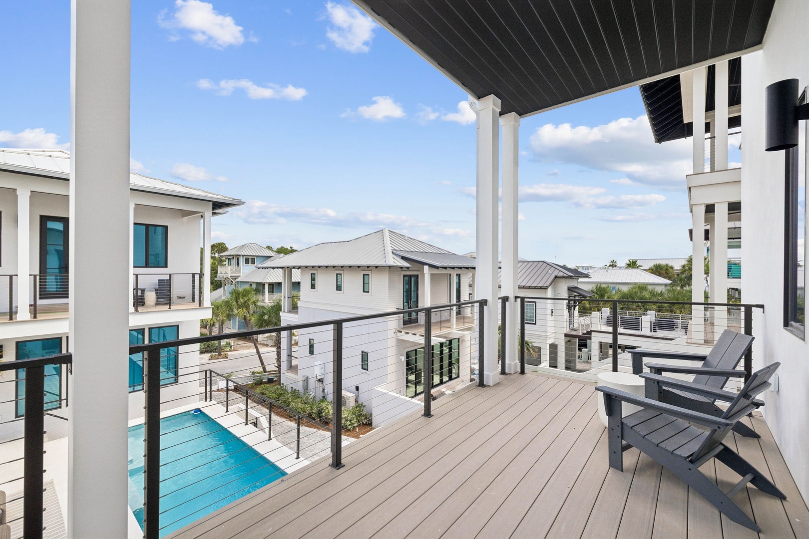 Soak up the Florida sunshine from your covered balcony, complete with comfortable seating and views of the sparkling pool below and surrounding coastal neighborhood.