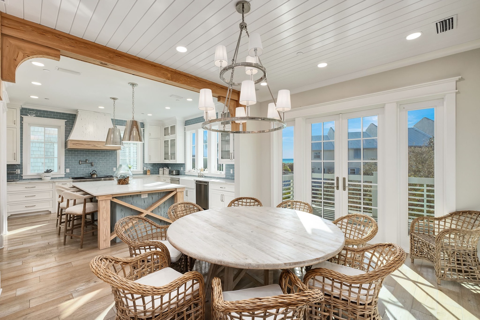 Your bright open-concept space flows seamlessly from kitchen to dining, with stunning mountain views through expansive windows creating the perfect gathering spot.