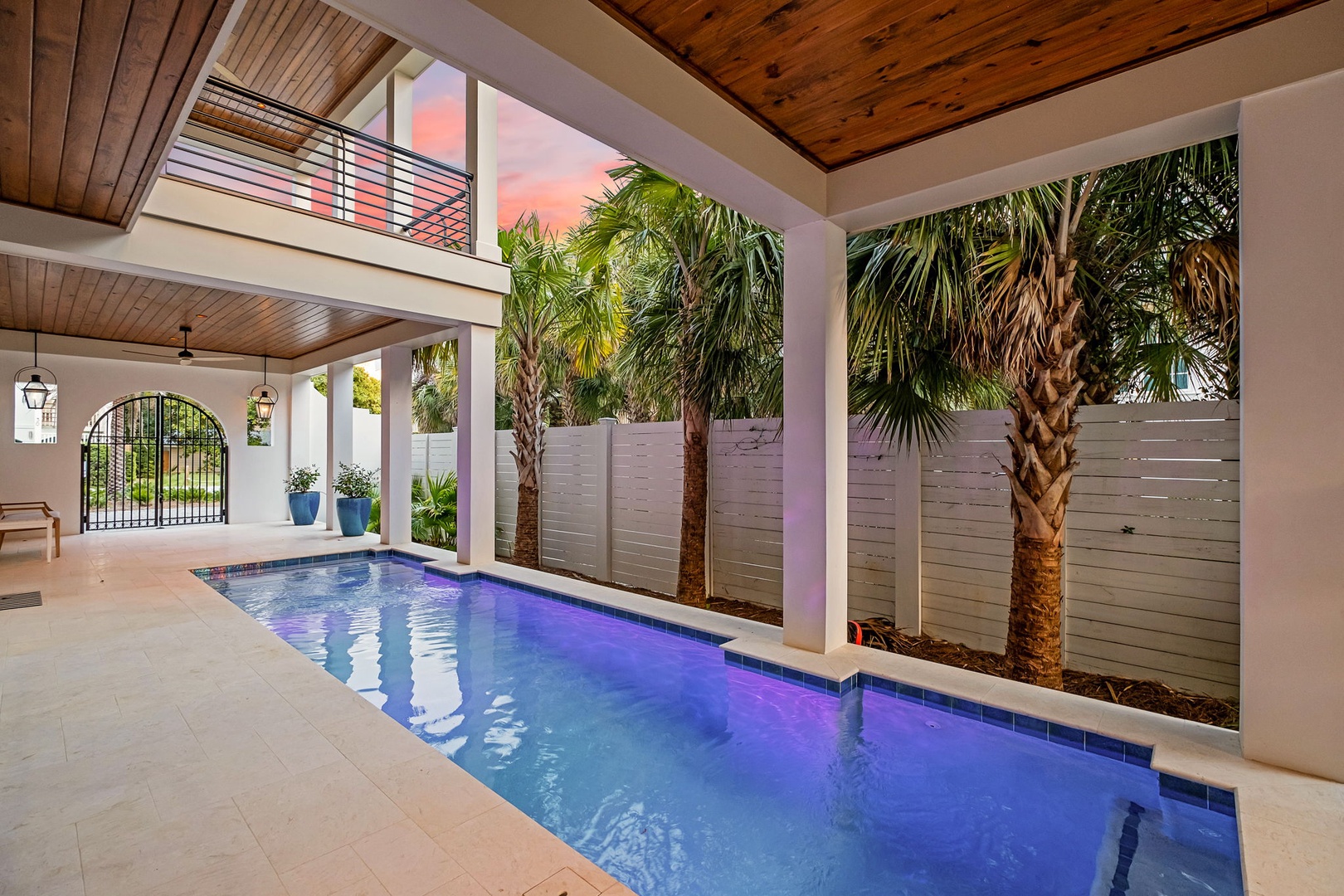 Your private oasis awaits—dive into crystal-clear waters surrounded by tropical palms and elegant architecture for the ultimate relaxation experience.