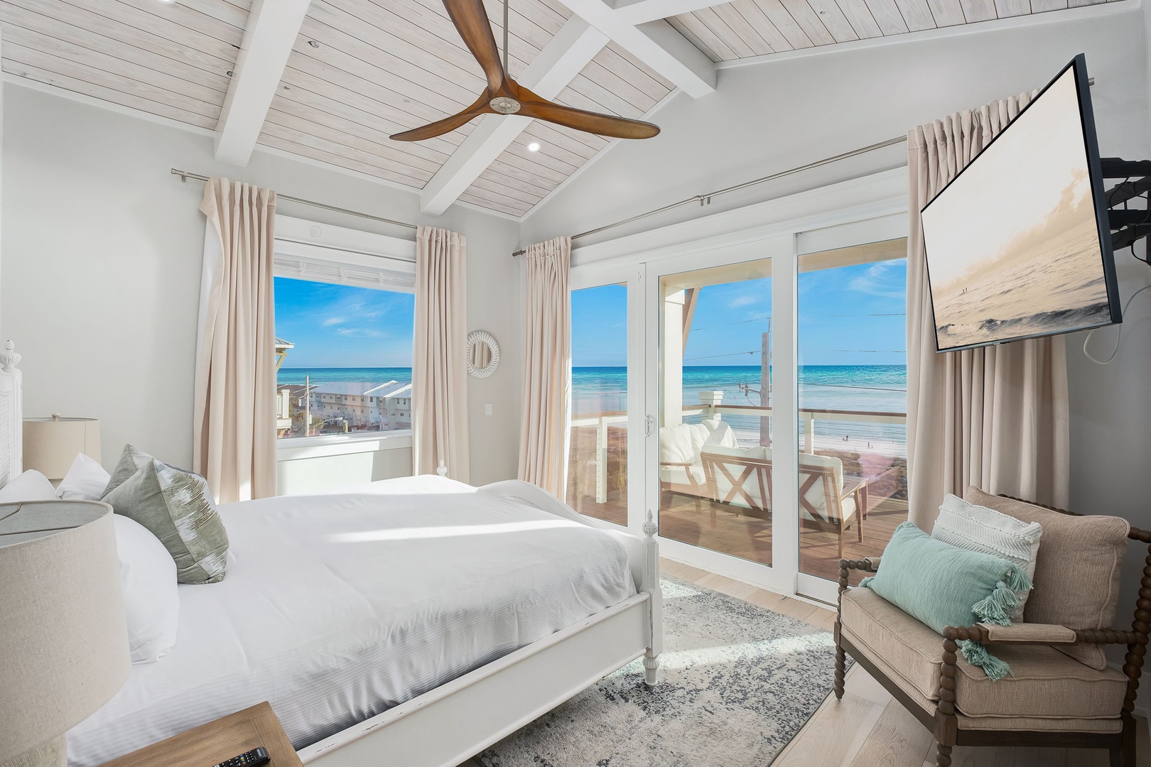 Drift off to sleep in this serene bedroom where ocean breezes flow through your private balcony doors and endless gulf views greet you each morning.