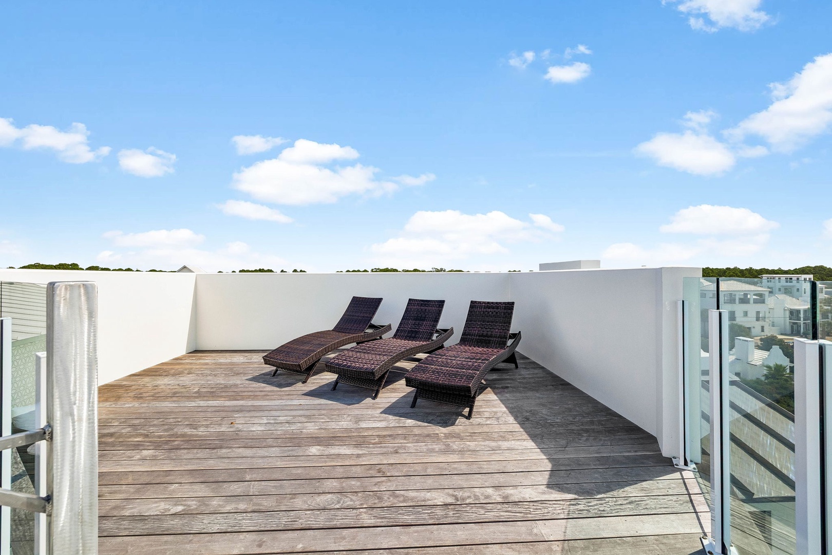 Soak up the sun and unwind in your private rooftop terrace, complete with three plush lounge chairs and sweeping sky views—a perfect retreat after exploring.