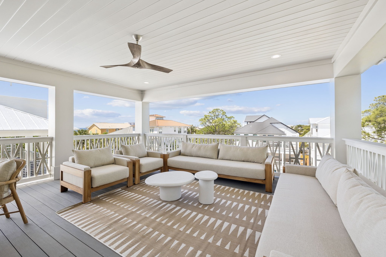 Unwind on your private covered terrace with plush seating and gentle breezes from the ceiling fan overhead.