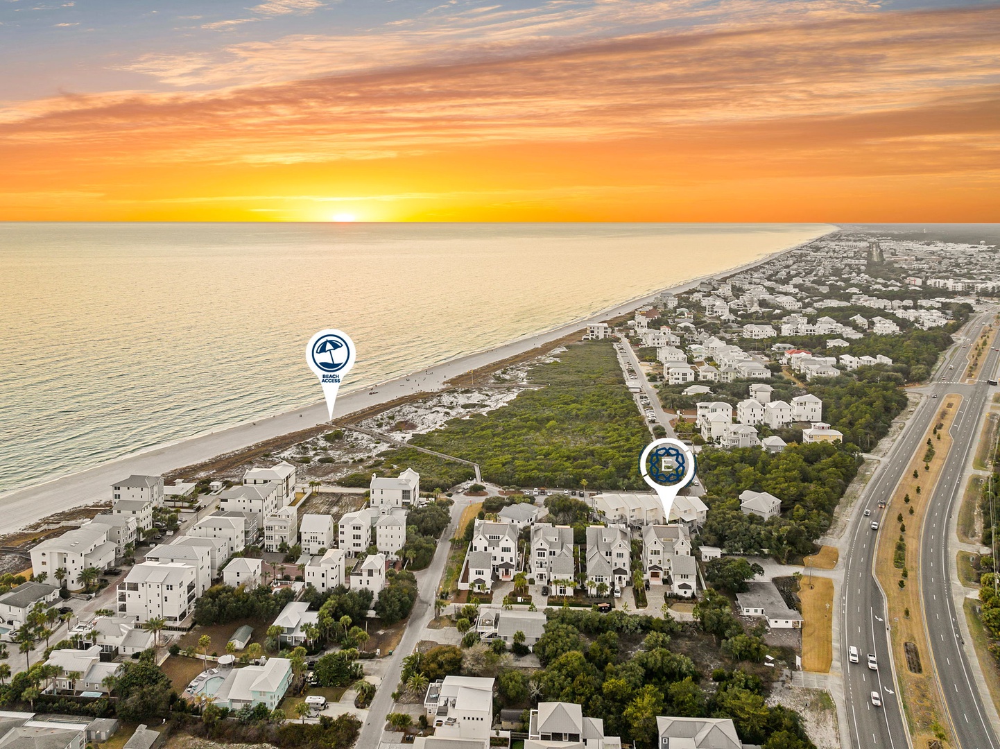 Stunning aerial view captures the coastal community at sunset with pristine beaches and nearby residential development.