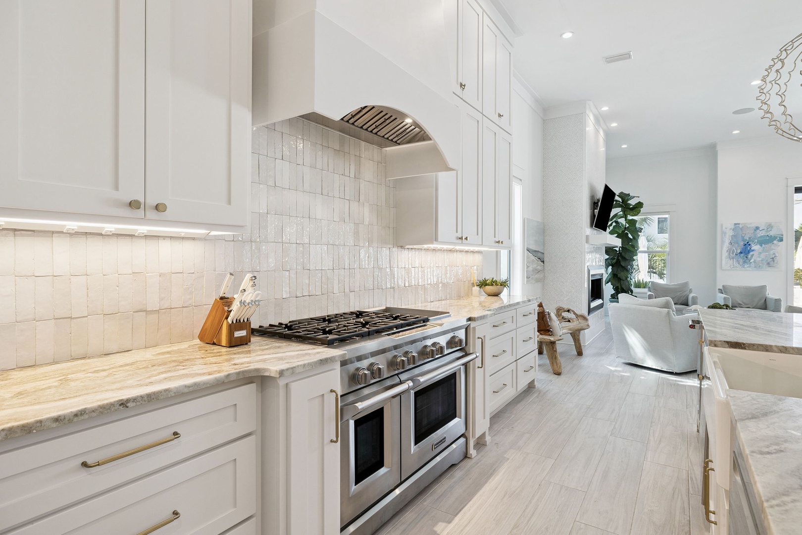 Your gourmet kitchen awaits with pristine white cabinetry, professional-grade appliances, and elegant marble countertops for memorable culinary moments.