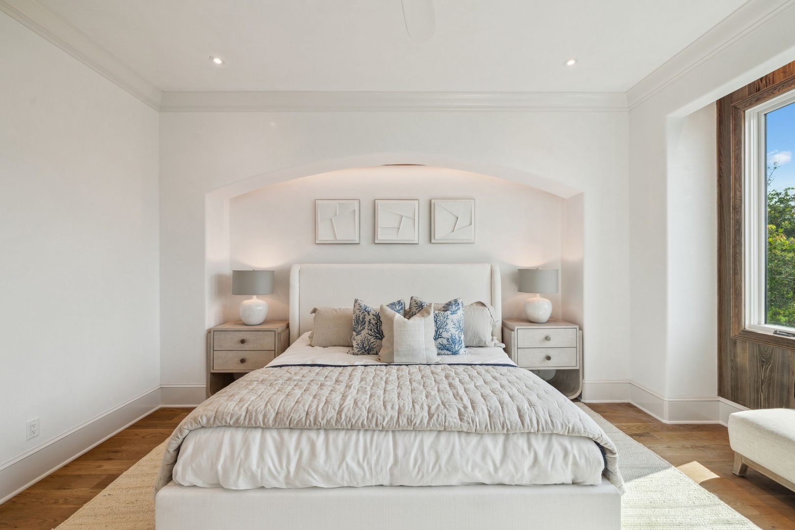 Sink into this serene bedroom where soft linens and elegant touches create your perfect retreat. Natural light streams in as you unwind in peaceful luxury.