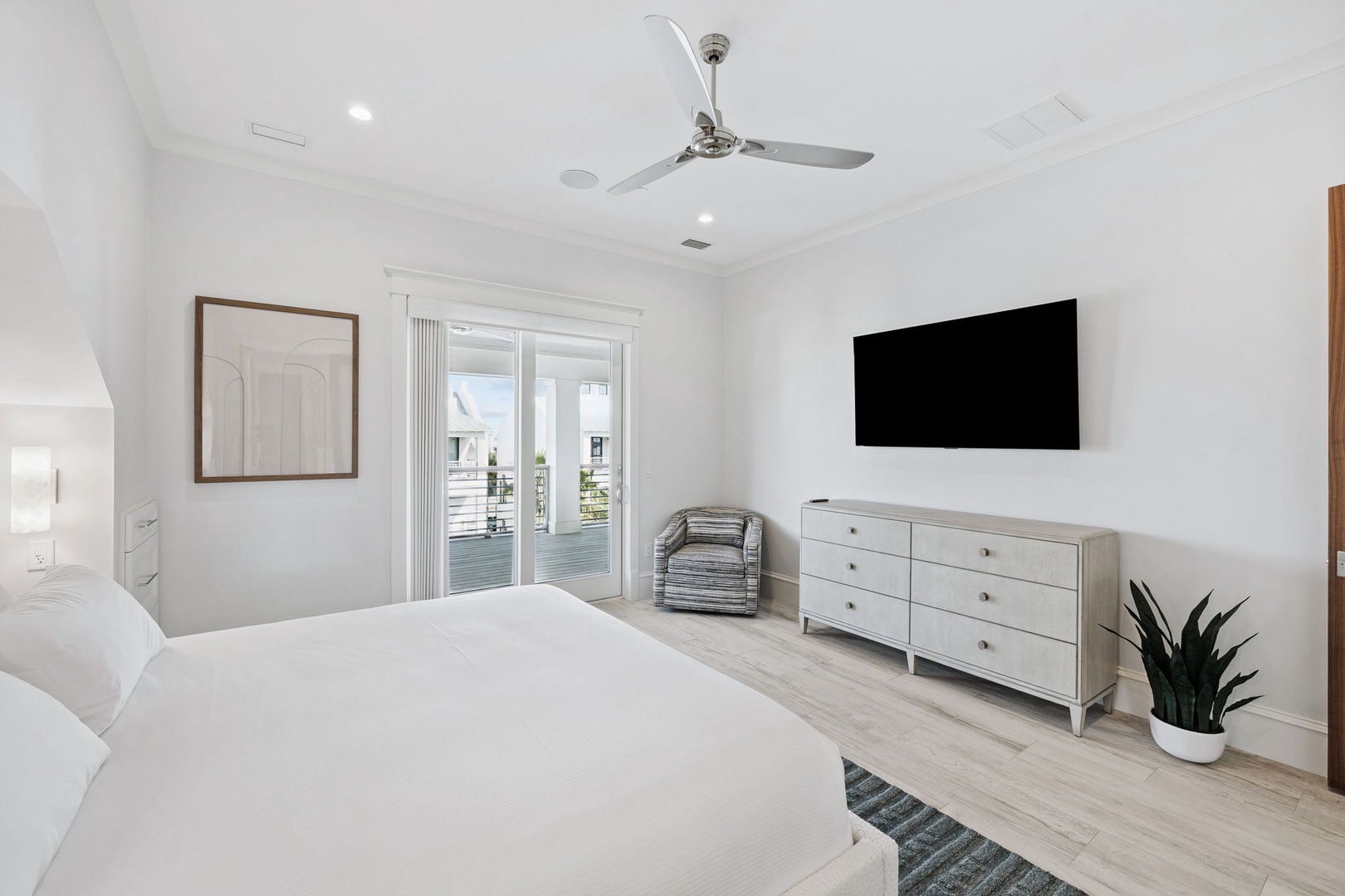 Unwind in your serene bedroom with crisp linens, modern amenities, and a private balcony overlooking peaceful water views.