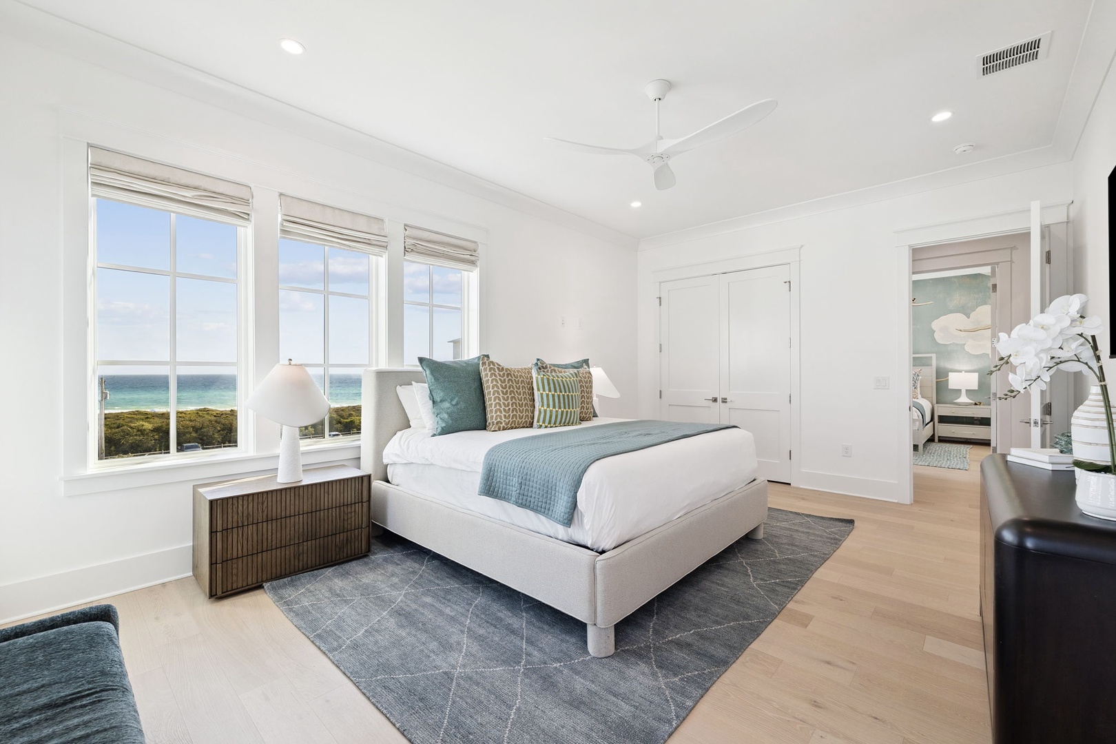 Wake up to stunning ocean vistas from your serene bedroom, where coastal breezes and gentle waves create the perfect retreat.