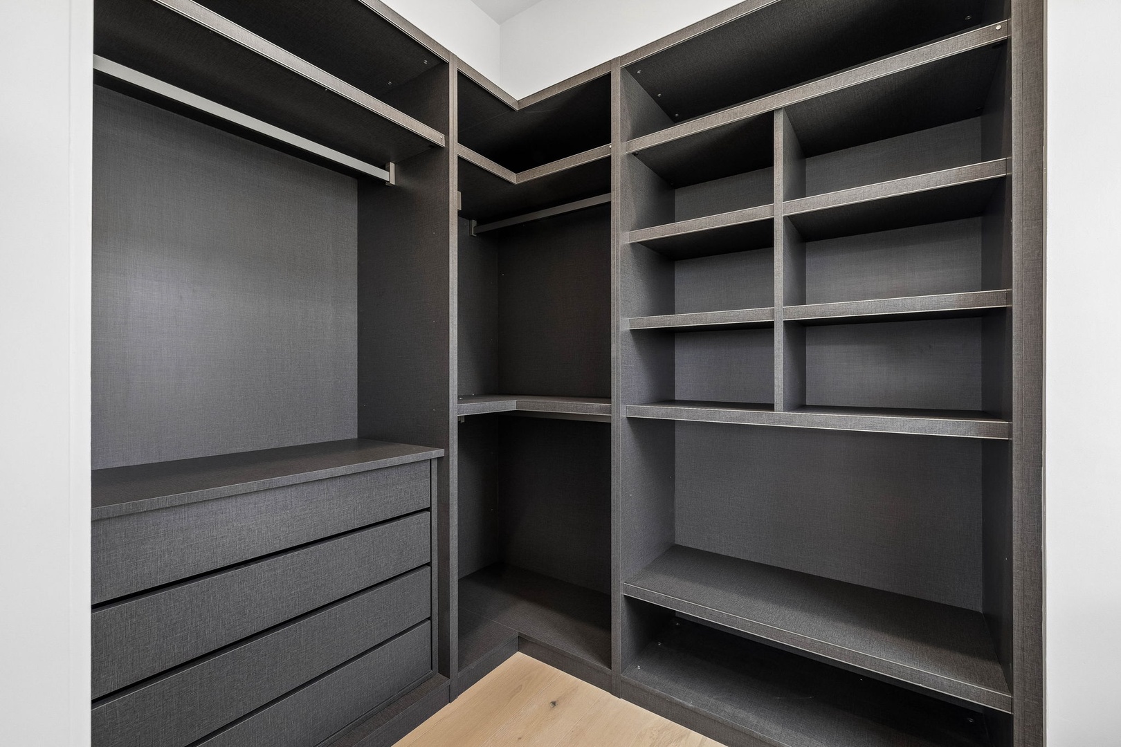 Unpack and settle in with ease—your spacious walk-in closet offers generous shelving, hanging space, and built-in drawers to keep everything perfectly organized.