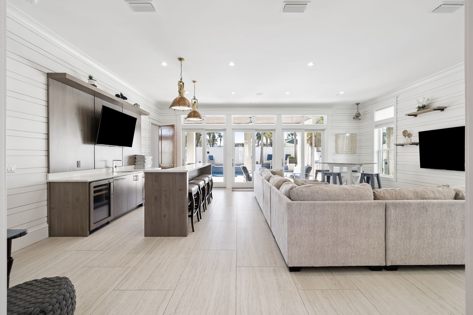Step into your modern open-plan sanctuary where sleek kitchen flows into cozy living space, perfect for gathering with loved ones.