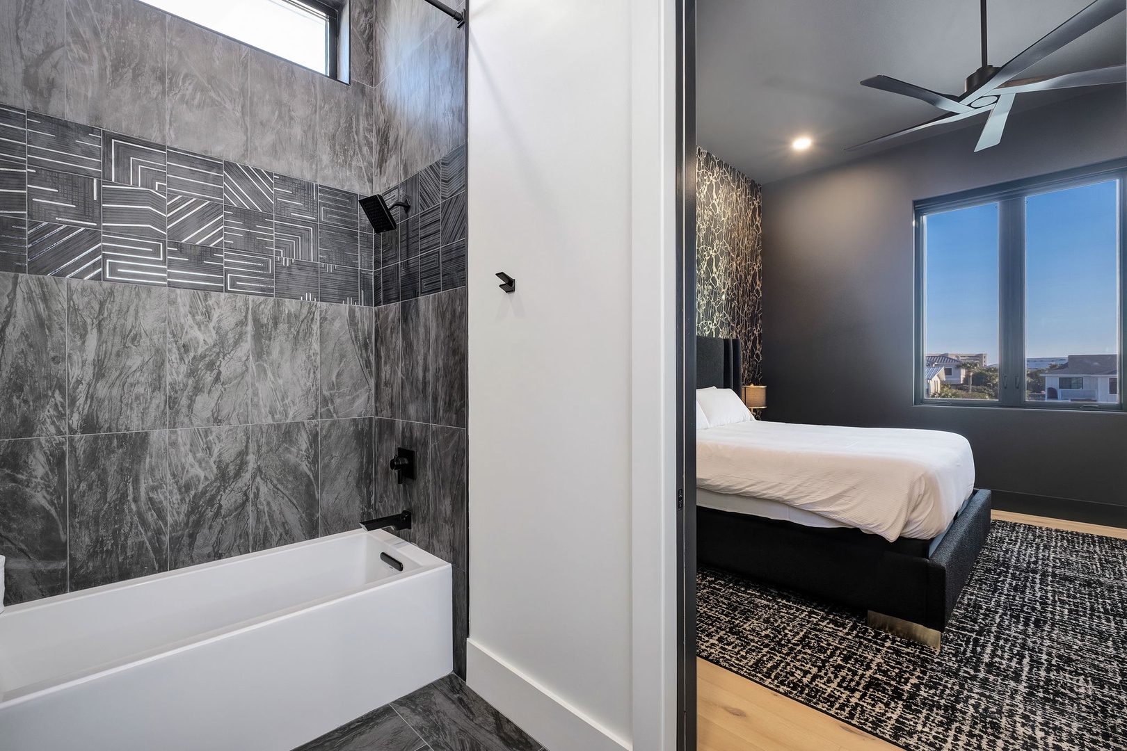Unwind in your stylish bathroom featuring luxurious marble-like tiles and modern fixtures, with your comfortable bedroom just steps away.
