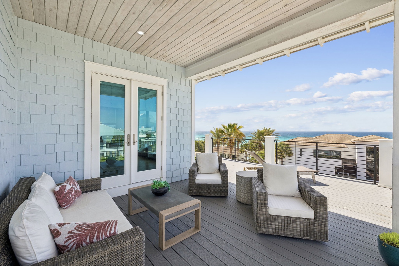 Unwind on your private covered deck with plush seating and stunning ocean views stretching to the horizon.