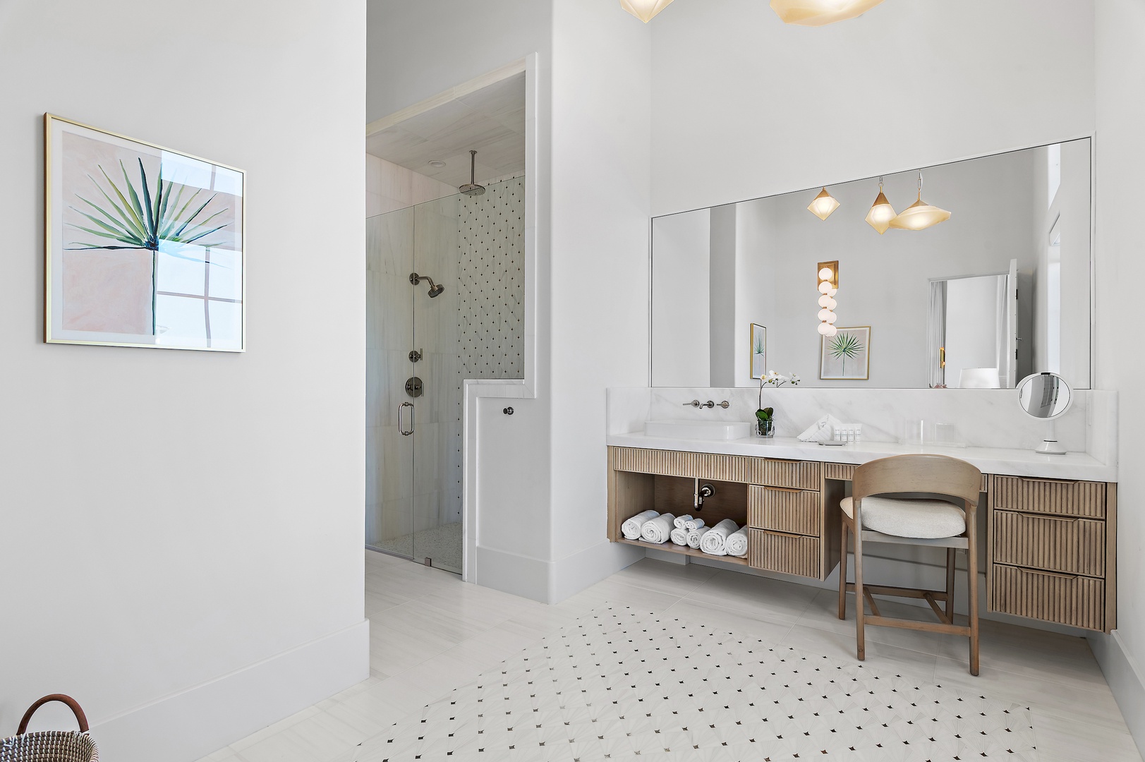 Step into your serene spa-like bathroom with sleek double vanity, walk-in shower, and natural light—a tranquil retreat for unwinding after sunny beach days.
