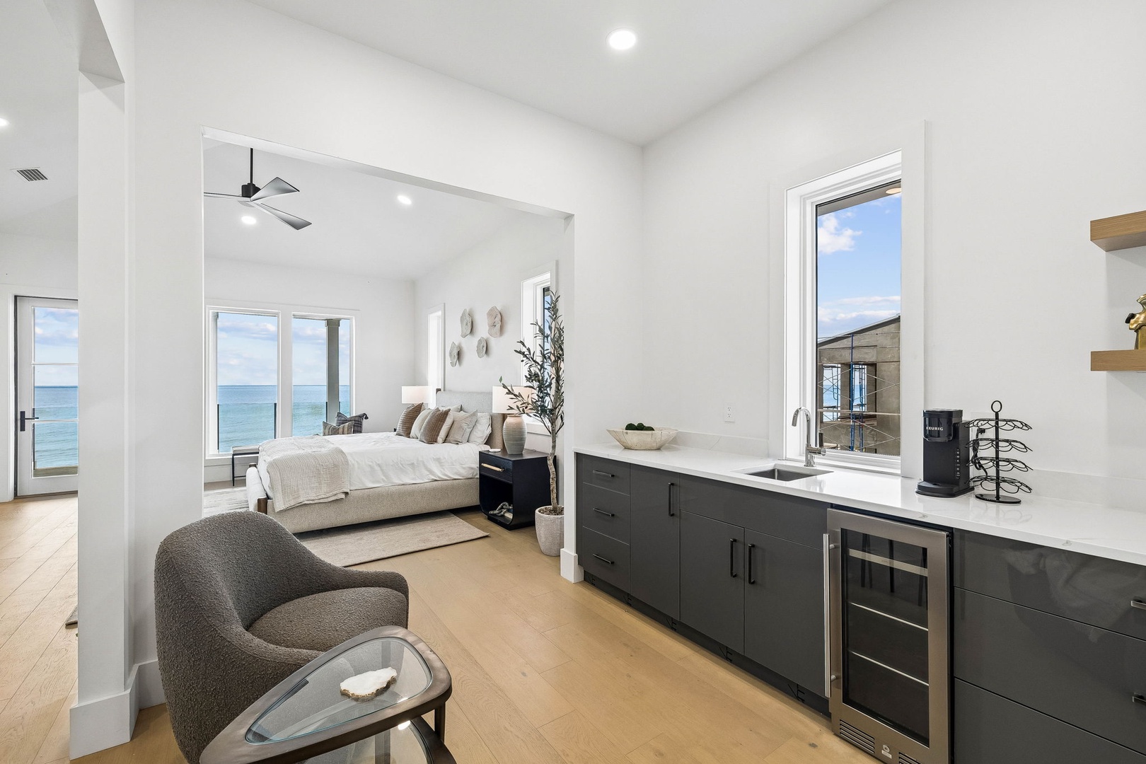 Step into your serene beachfront suite where soft ocean breezes and stunning sea views greet you from the moment you arrive, with a thoughtfully designed kitchenette area perfect for morning coffee.