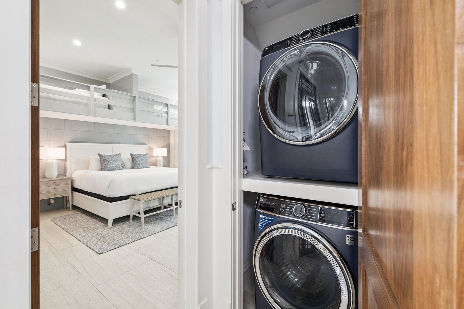Your in-suite washer and dryer keep your clothes fresh throughout your stay, while the comfortable bedroom awaits just steps away.